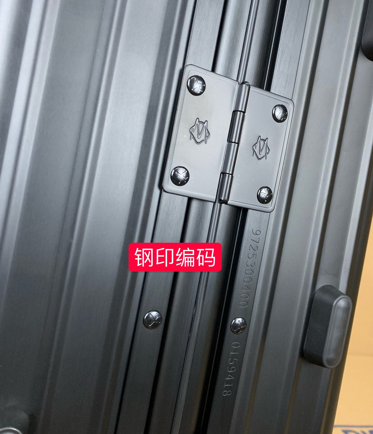 Sleek Matte Black Ribbed Carry-On Hardshell Spinner Suitcase