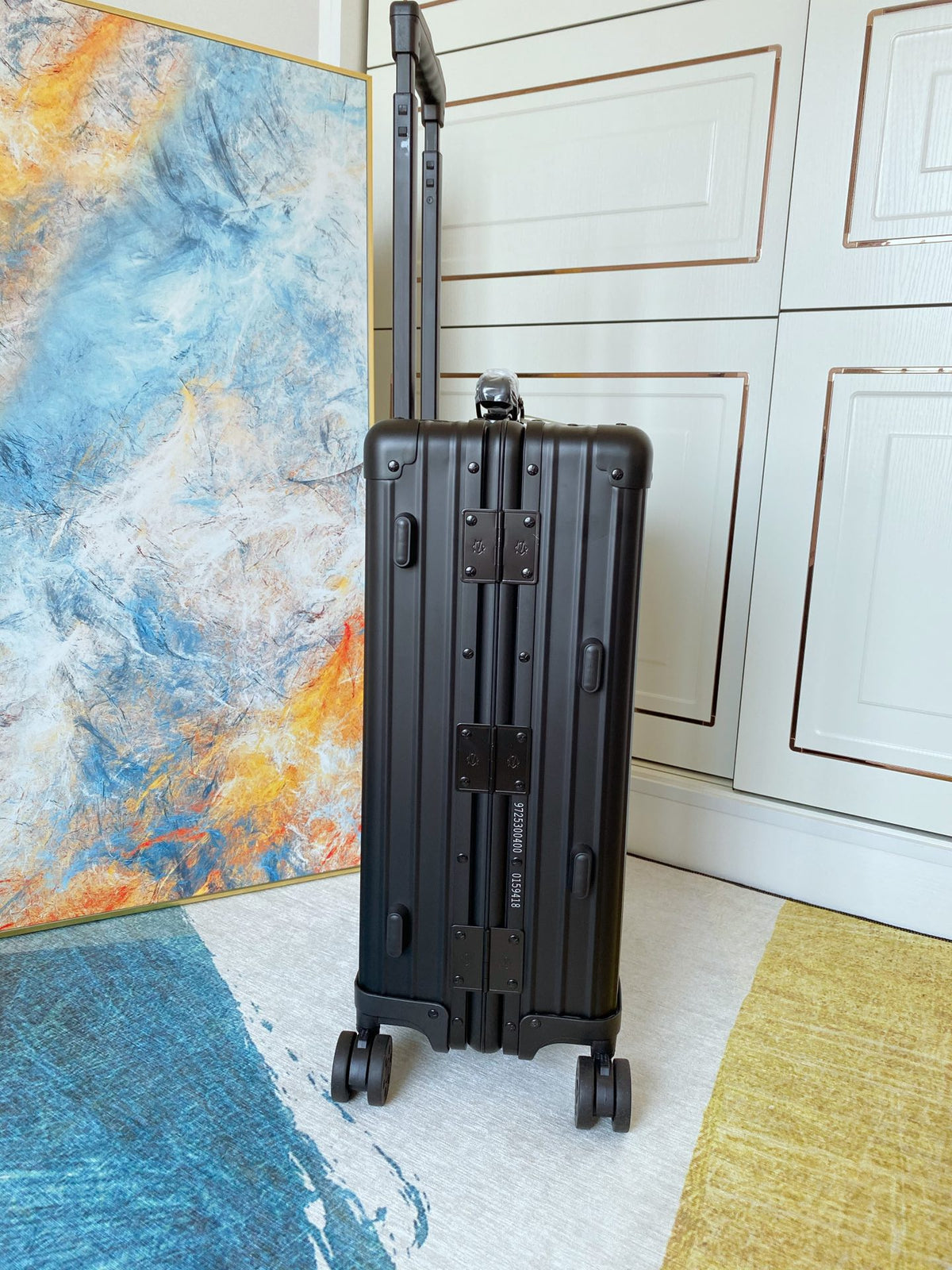 Sleek Matte Black Ribbed Carry-On Hardshell Spinner Suitcase