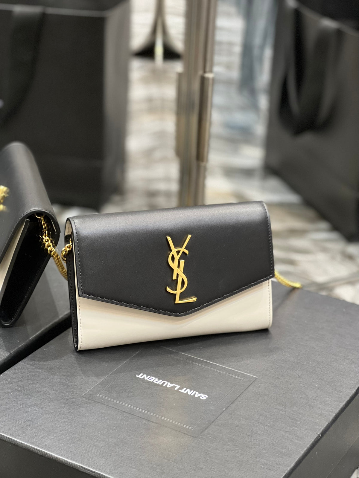 Saint Laurent Uptown Chain Wallet in Black and White Leather