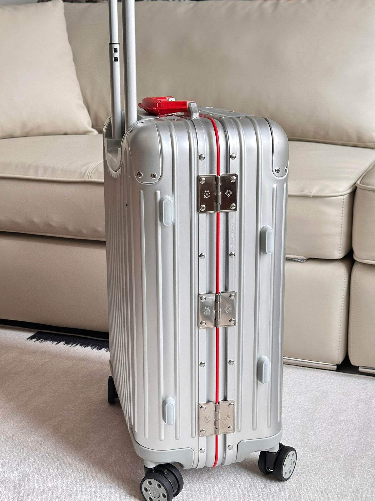 Silver Ribbed Hardside Spinner Suitcase with Red Accent Handle